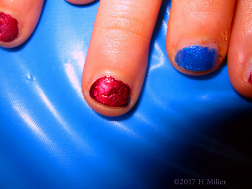 A Closeup Of The Pink Shatter Girls Manicure