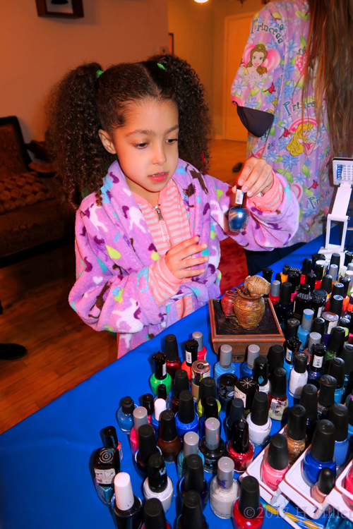 Checking Out The Different Polish Colors At The Kids Nail Spa.