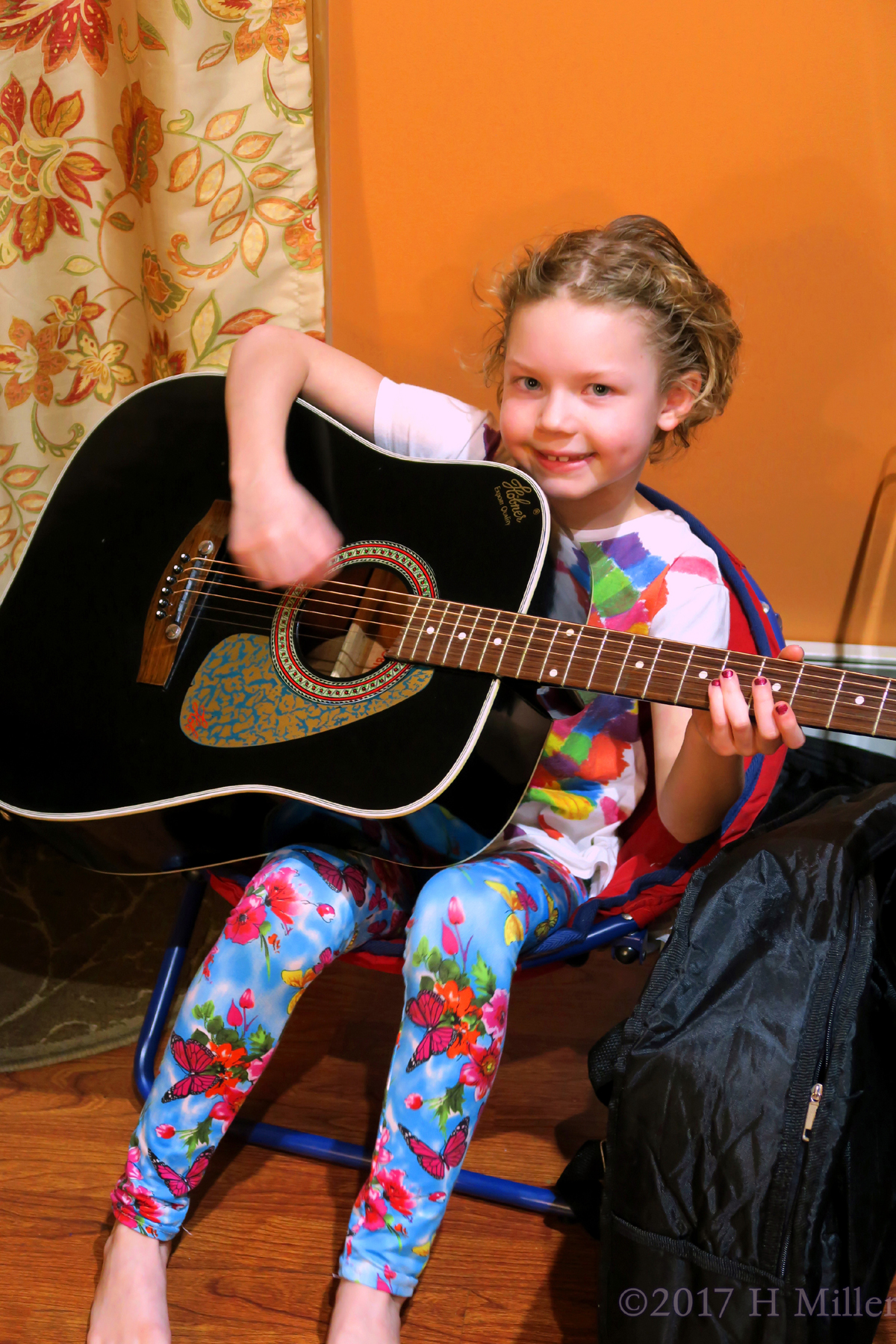 Playing The Guitar And Smiling. 