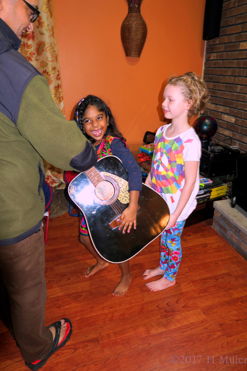 Playing With The Guitar After Kids Spa Treatments.