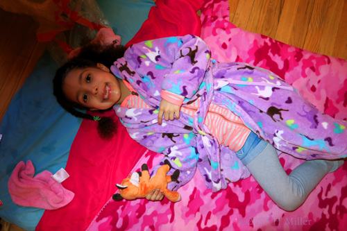 Smiling Before Her Girls Facial With Her Stuffed Animal Friend. Smiling Before Her Girls Facial With Her Stuffed Animal Friend.