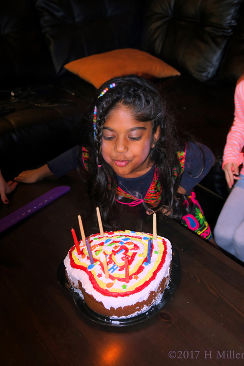 The Birthday Girl Blows Out The Candles On Her Cake!