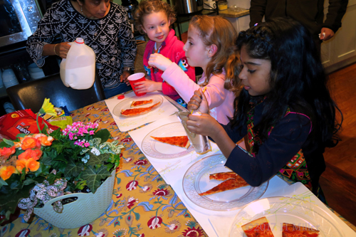 The Party Guests Are Enjoying Their Pizza!