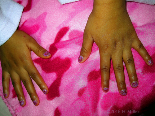 Nia Showing Her Nail Designs.