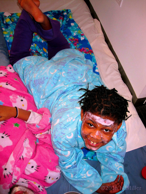 Smiling A For Photo During Her Kids Facial. Smiling A For Photo During Her Kids Facial.