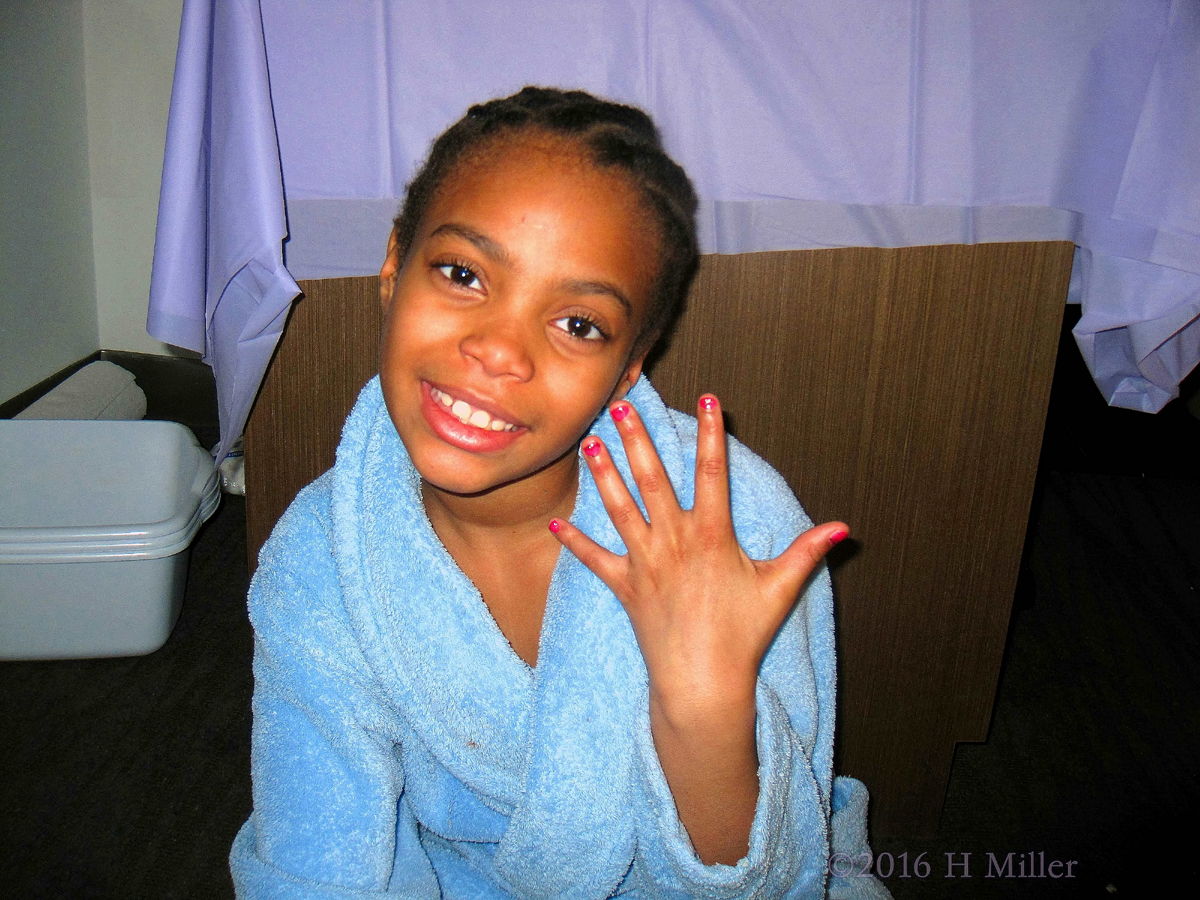 Smiling And Showing Her Mini Manicure.