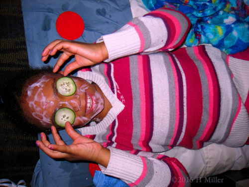 Adjusting Her Cukes During Kids Facials At The Spa Party.