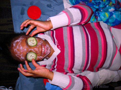 Adjusting Her Cukes During Kids Facials At The Spa Party. Adjusting Her Cukes During Kids Facials At The Spa Party.