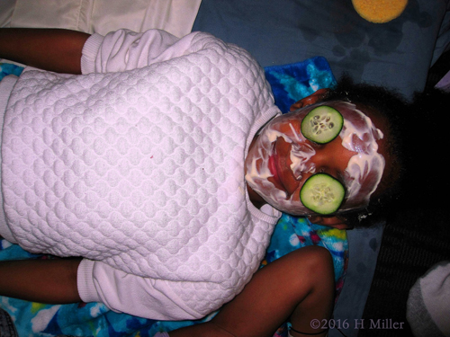 Having Fun With Kids Facials With Cukes On Her Eyes.