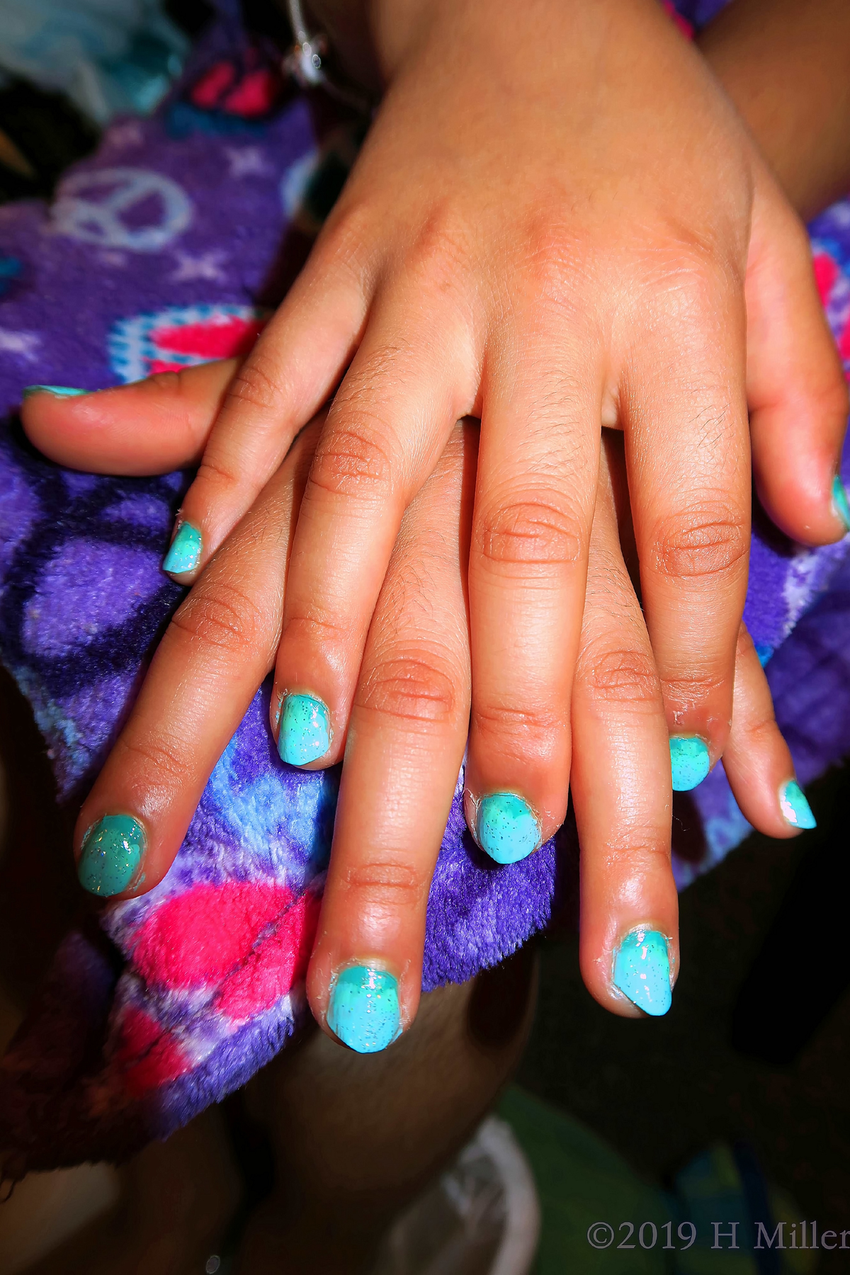 Beautiful Kids Mani Featuring An Ombre Nail Design With Two Shades Of Blue With Glitter 