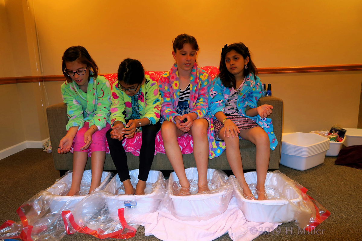 The Birthday Girl Enjoys Her Kids Pedicure Footbath With The Other Spa Party Guests 