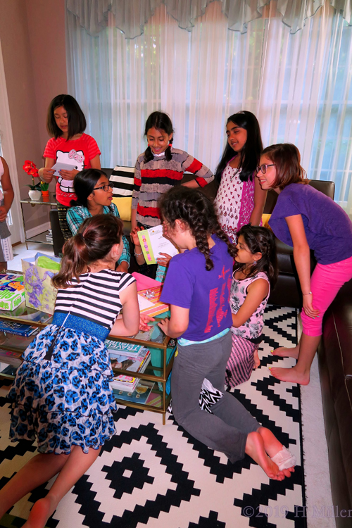 Birthday Guests Gather Around Nidhi As She Opens Her Presents