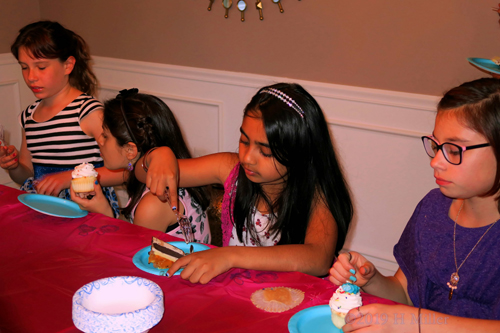 Time To Dig In! Birthday Guests Enjoy Tasty Snacks Time To Dig In! Birthday Guests Enjoy Tasty Snacks