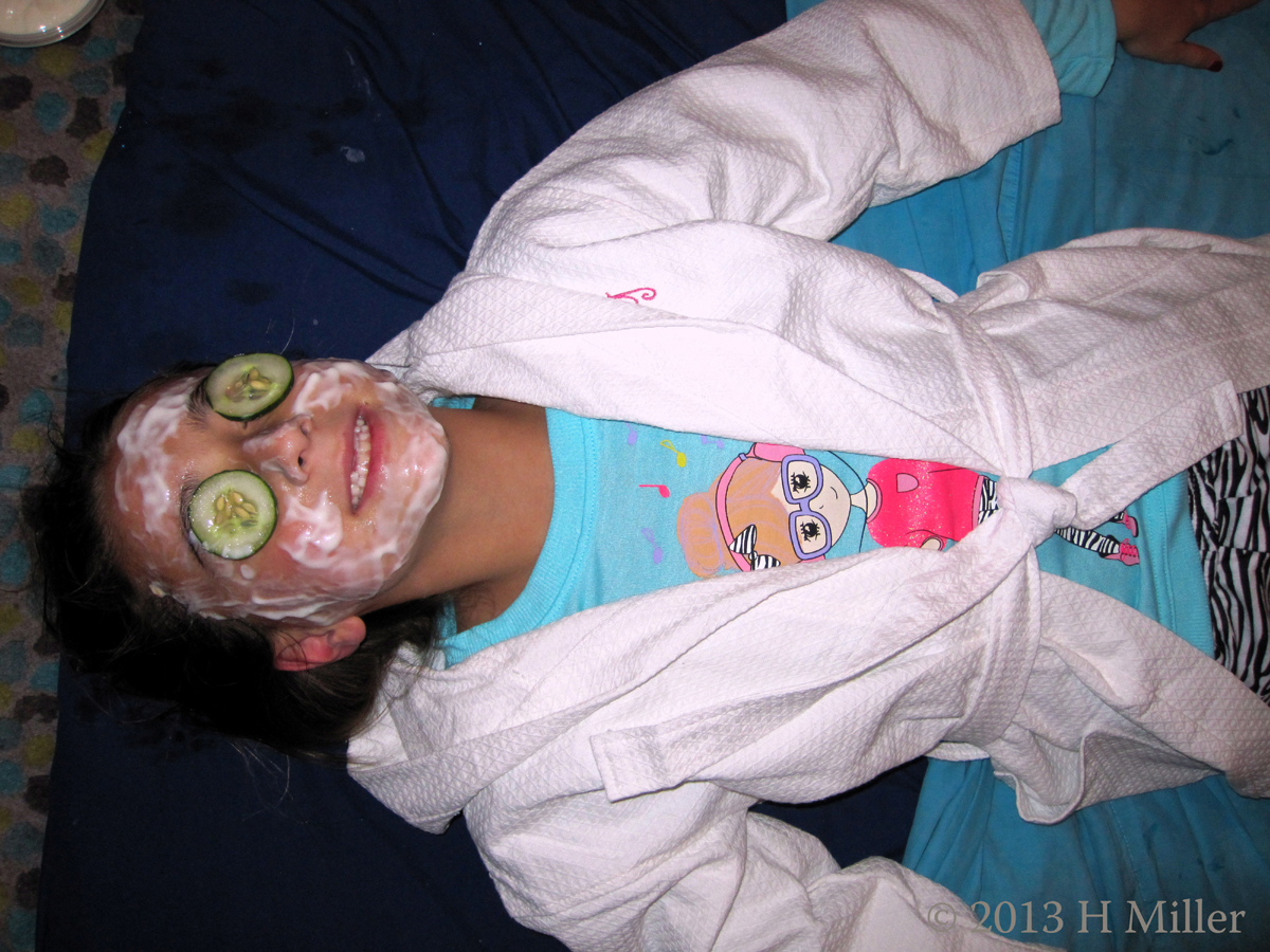 Relaxing And Smiling During Kids Mobile Facial Activity 