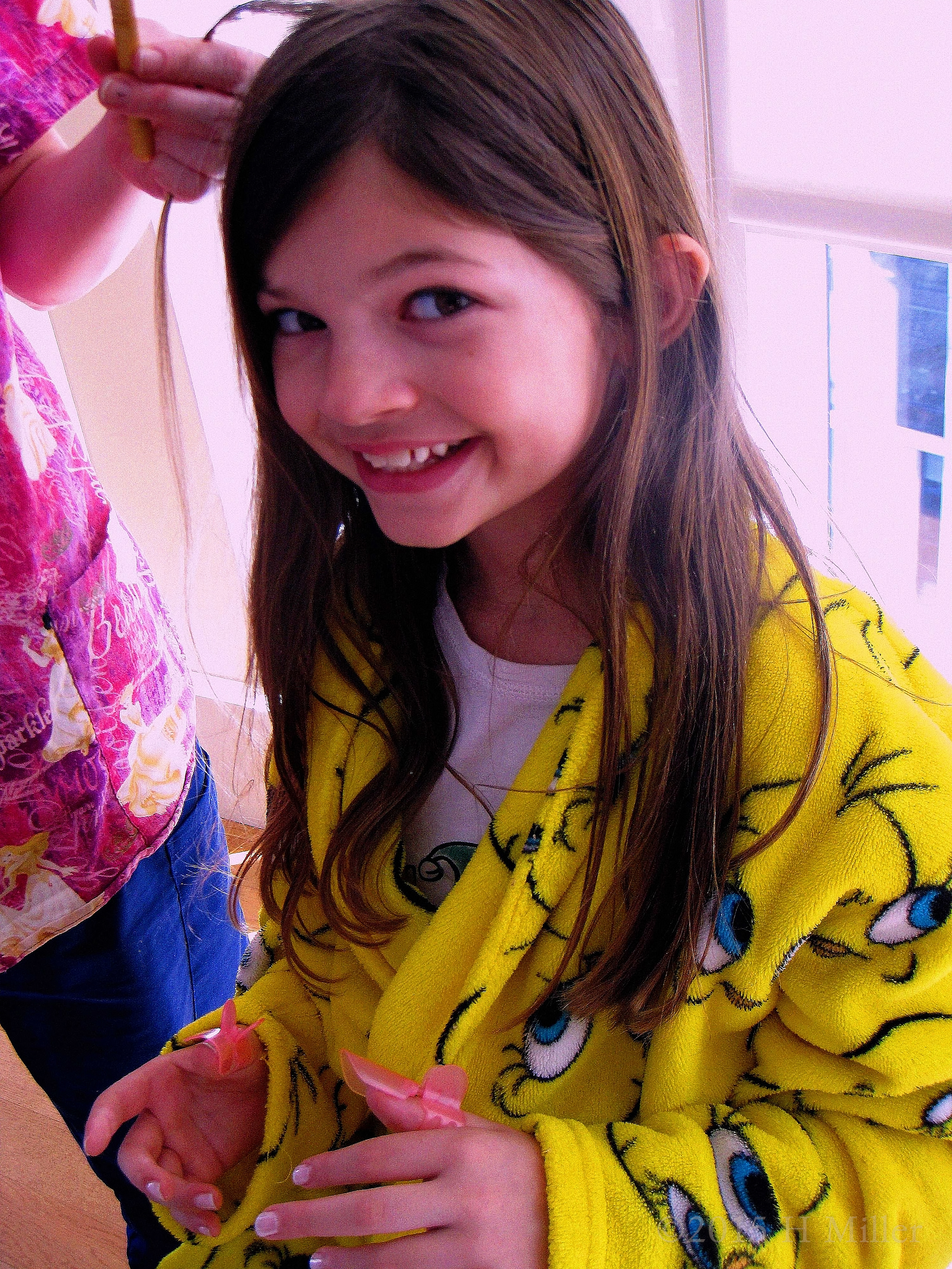 Having A Feather Put In Her Hair. Having A Feather Put In Her Hair.