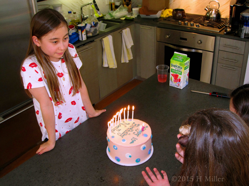 Noelle And Her Birthday Cake With Lit Candles.