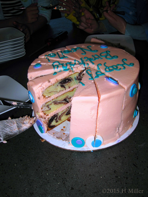 The Second Slice Of Pink Birthday Cake Being Cut. The Second Slice Of Pink Birthday Cake Being Cut.
