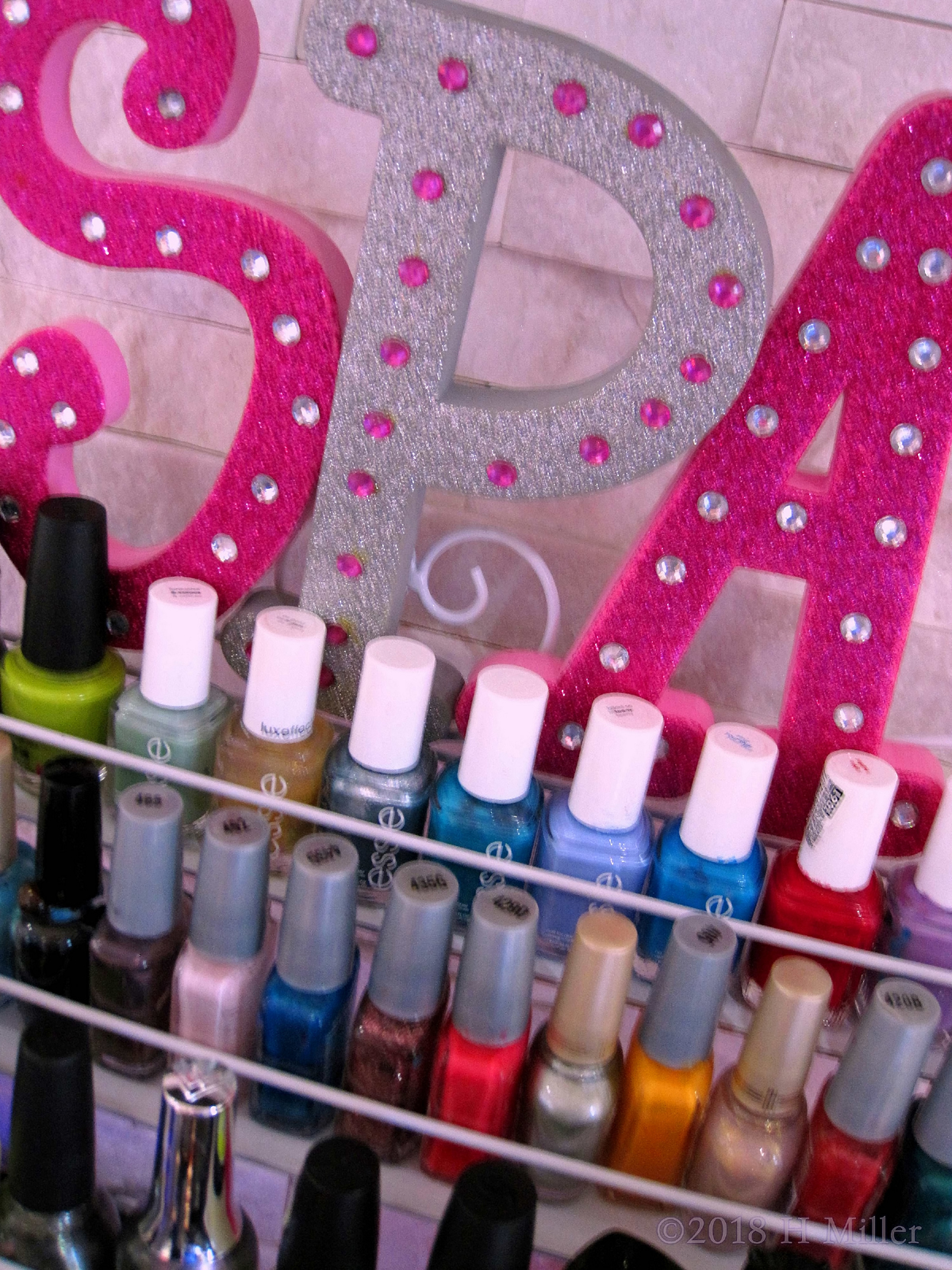 A Closeup Of The Various Shades Of Nail Polish At The Kids Nail Salon. 