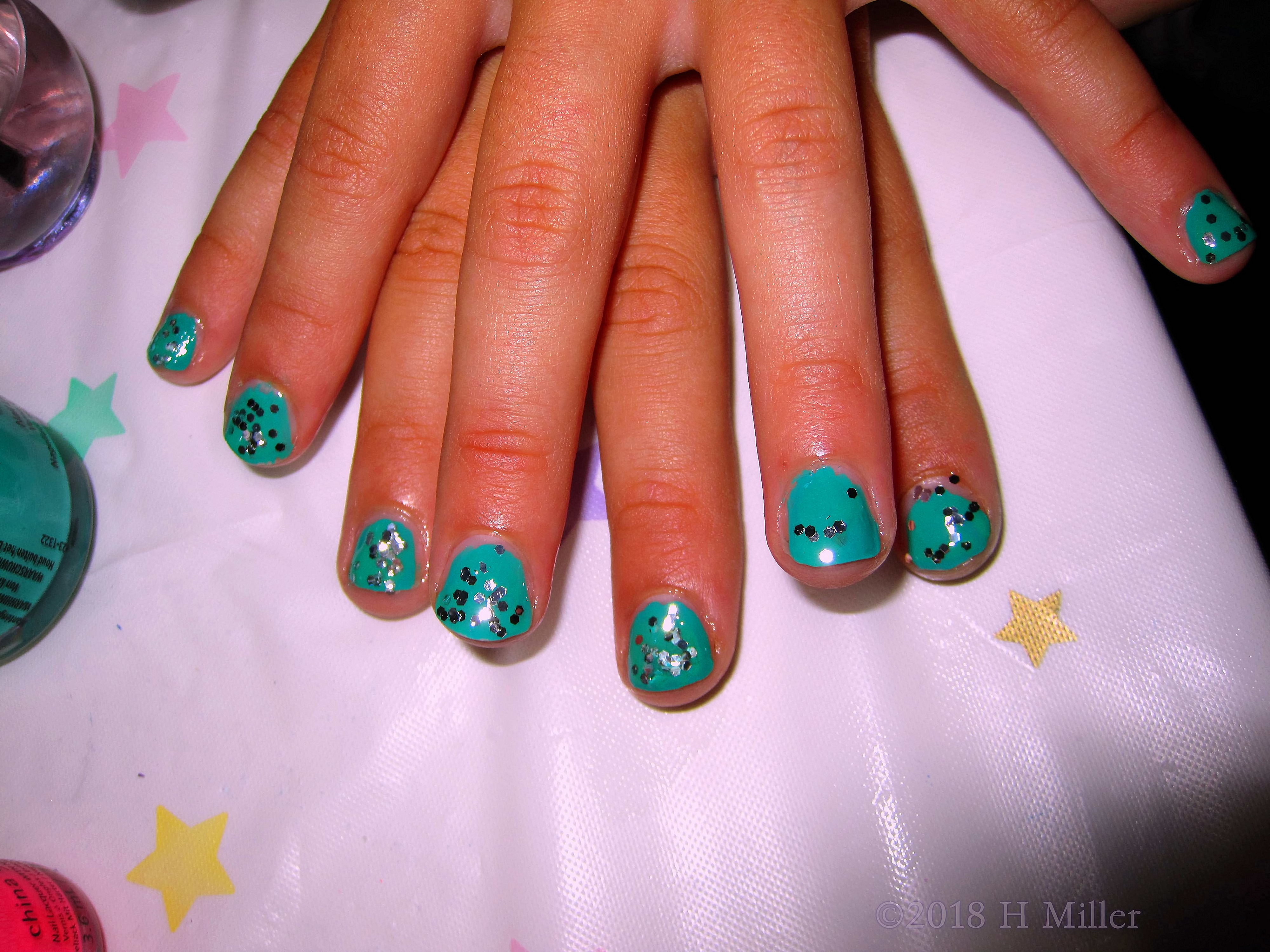 One Girls Manicure With The Glitter Over A Green Base, Elegant And Beautiful! One Girls Manicure With The Glitter Over A Green Base, Elegant And Beautiful!