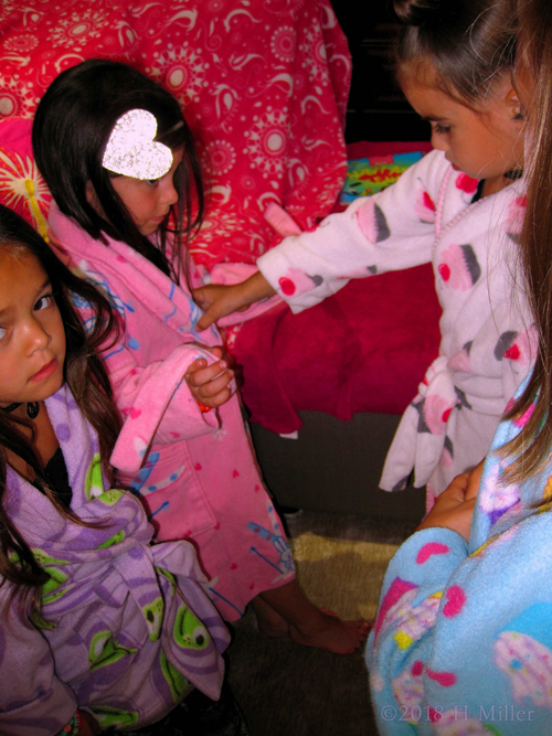 The Girls Helping Each Other Adjusting The Robe! The Girls Helping Each Other Adjusting The Robe!