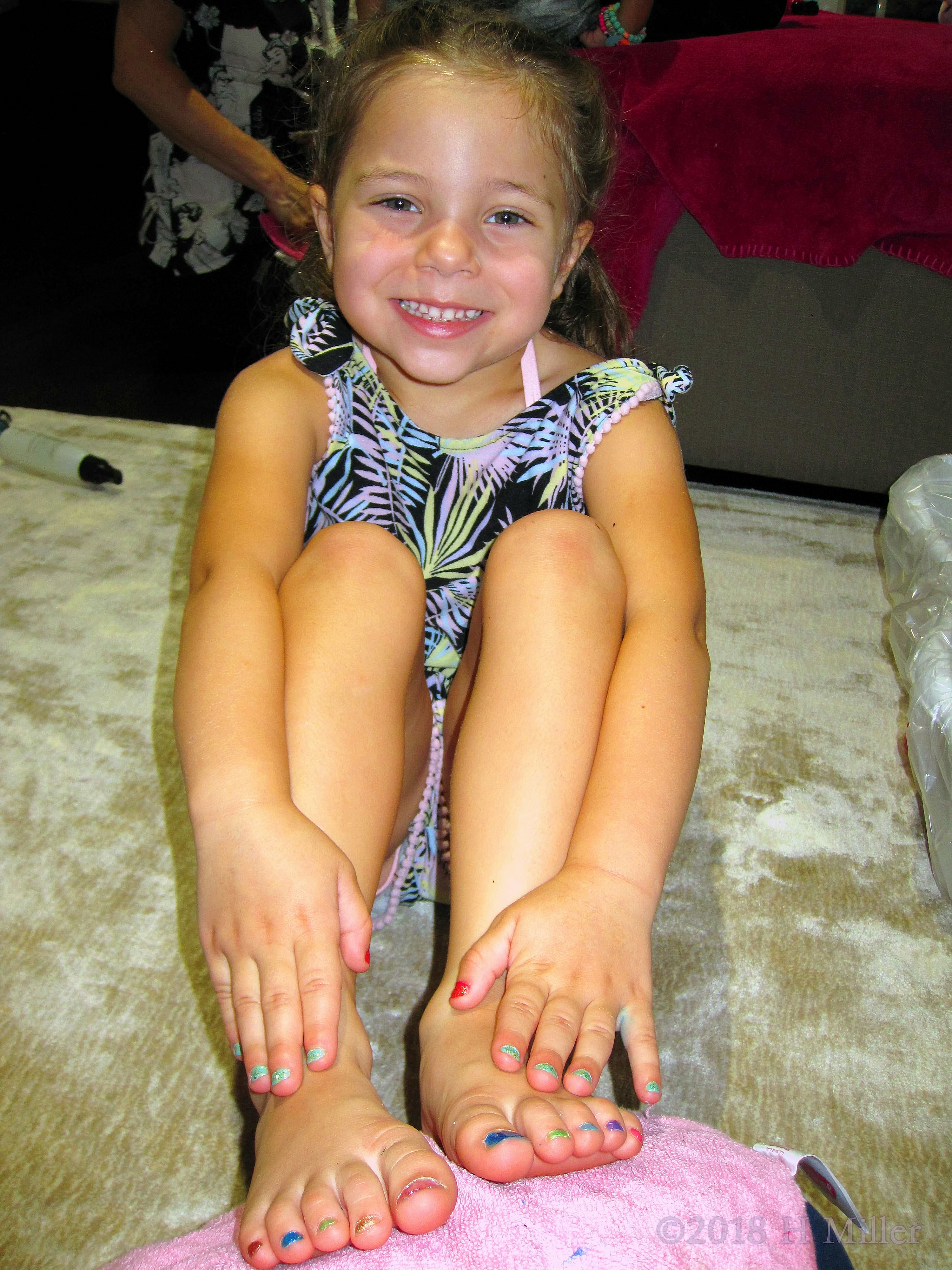 Cheerful And Smiling While Showing Her Mini Mani And Pedi. Cheerful And Smiling While Showing Her Mini Mani And Pedi.