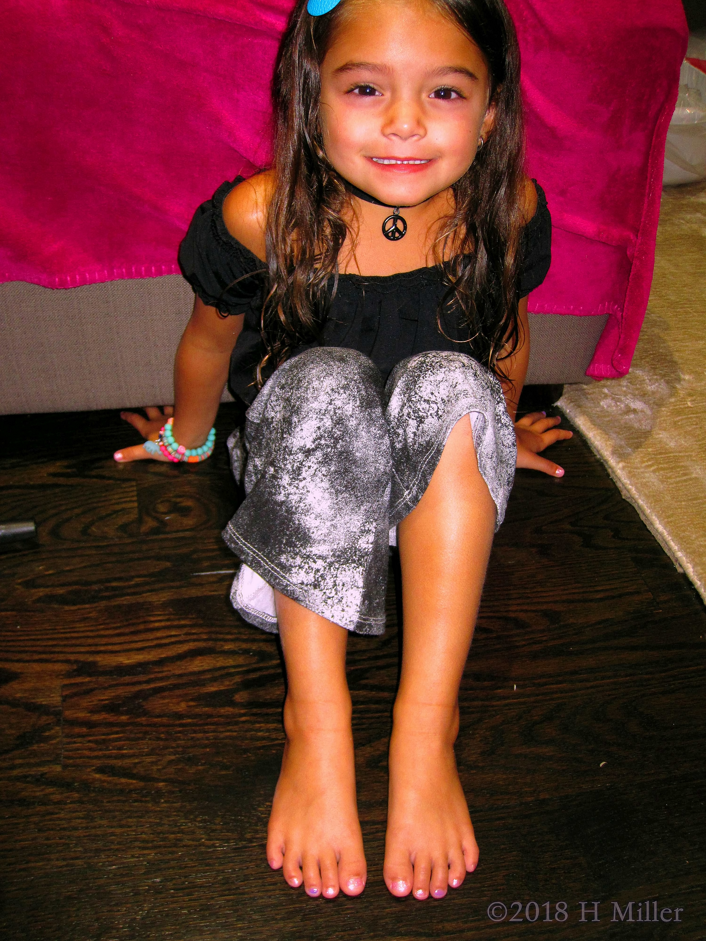 Cheerfully Posing After Her Kids Spa Pedicure. Cheerfully Posing After Her Kids Spa Pedicure.