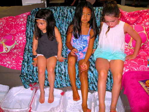 About To Relax Their Feet In Kids Pedicure Footbaths About To Relax Their Feet In Kids Pedicure Footbaths