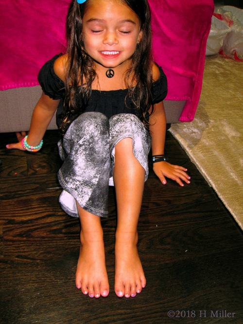Party Guest Enjoying And Showing Her Kids Pedicure After The Activities. Party Guest Enjoying And Showing Her Kids Pedicure After The Activities.