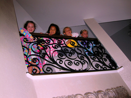 They Pose And Smile From The Top Floor.