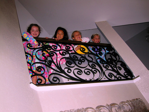 They Pose And Smile From The Top Floor. They Pose And Smile From The Top Floor.