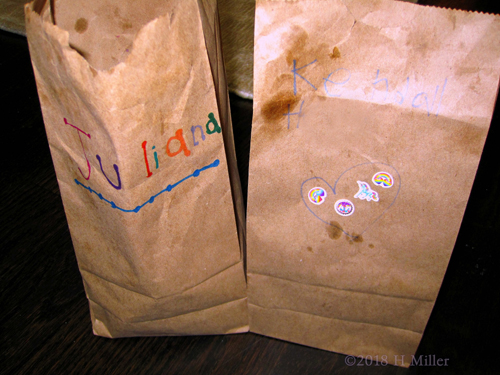 Two Bags Containing The Kids Crafts Activities For The Girls To Take Home