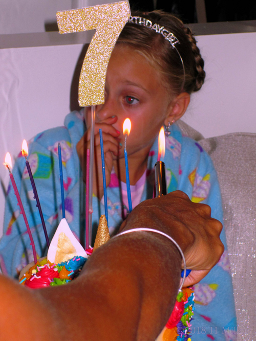 While Lighting The Birthday Candles.