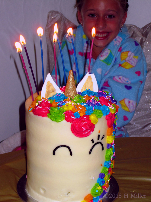 Yummy Unicorn Birthday Cake With Lighted Candles. Yummy Unicorn Birthday Cake With Lighted Candles.