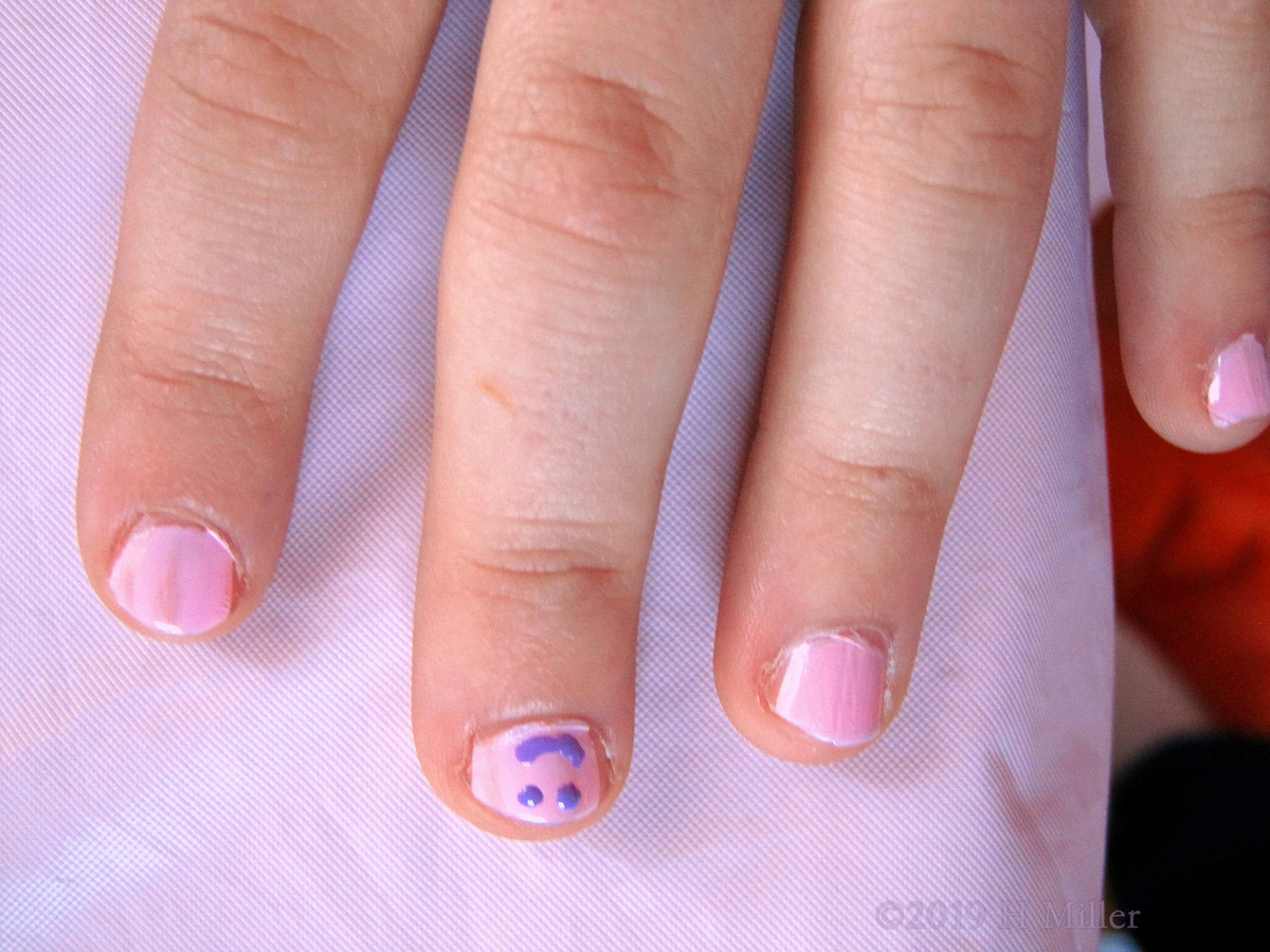 Close Up Of The Beautiful Pink And Blue Smiley Face Nail Art On This Lovely Kids Manicure! 