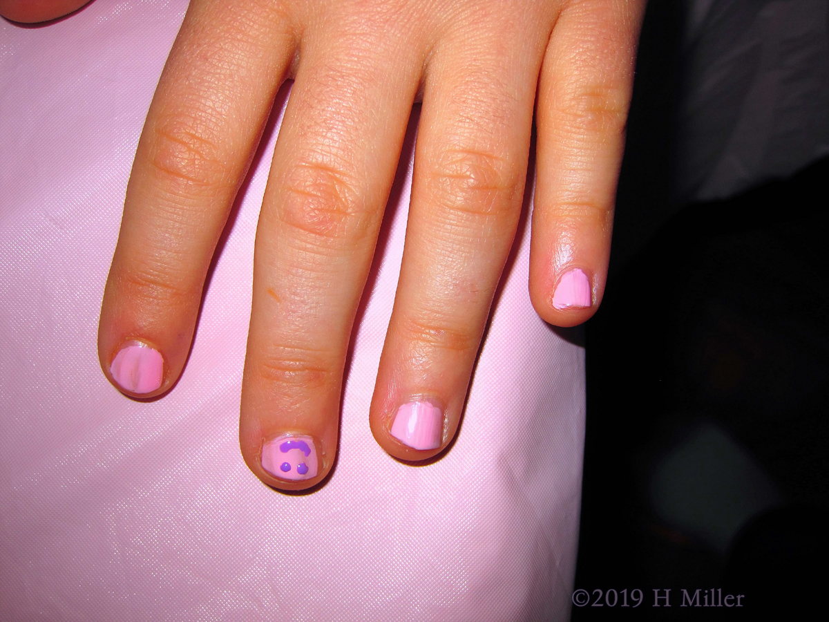 Kids Nail Art On A Pink Background With A Blue Smiley Face For This Girls Manicure! 