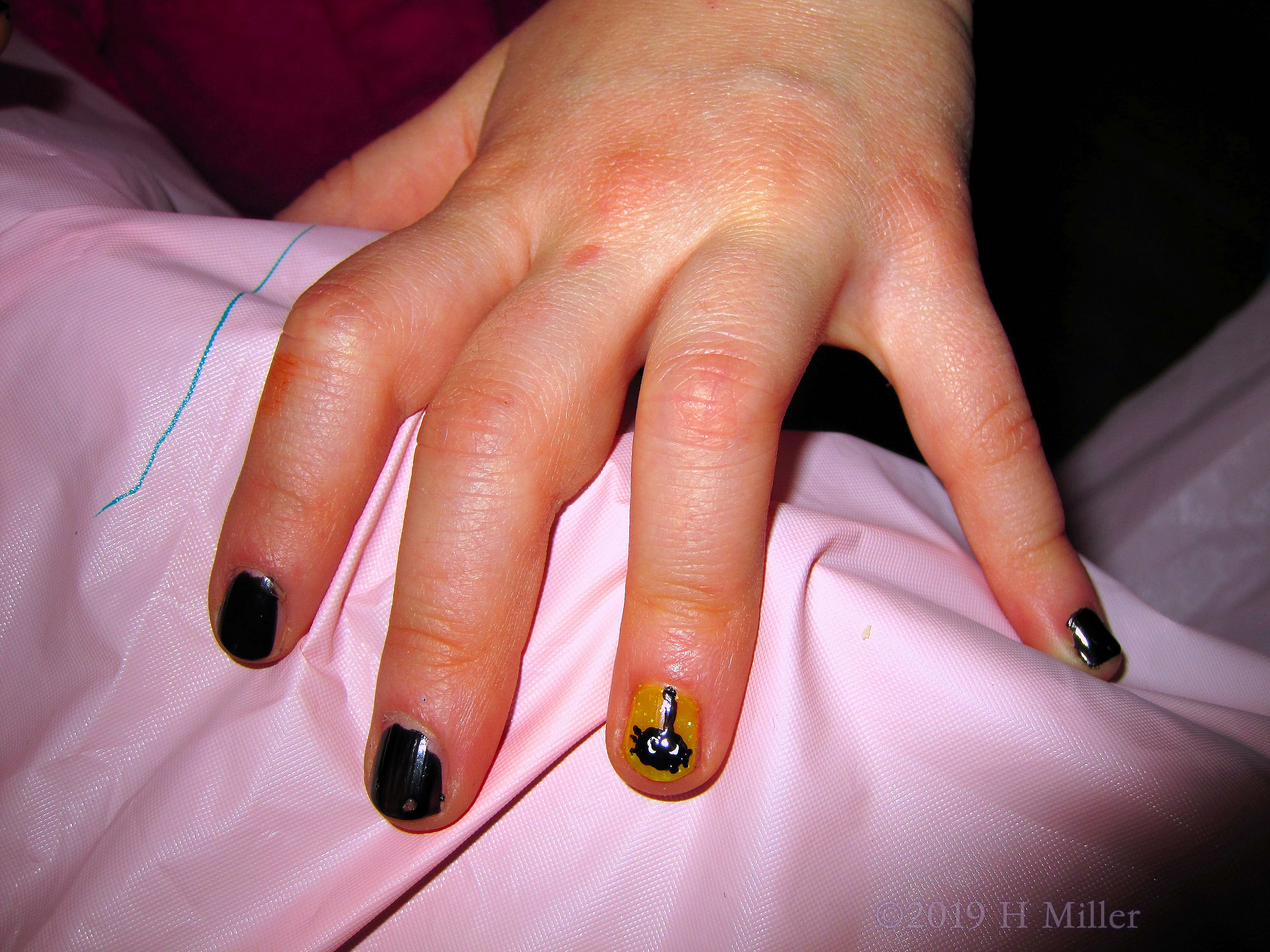 A Very Pretty Black Kids Manicure With A Spider Nail Design! 