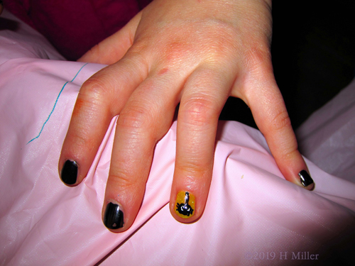 A Very Pretty Black Kids Manicure With A Spider Nail Design!