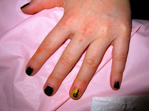 Kids Manicure With A Black Base And A Shimmery Yellow Background For The Black Spider Nail Design!