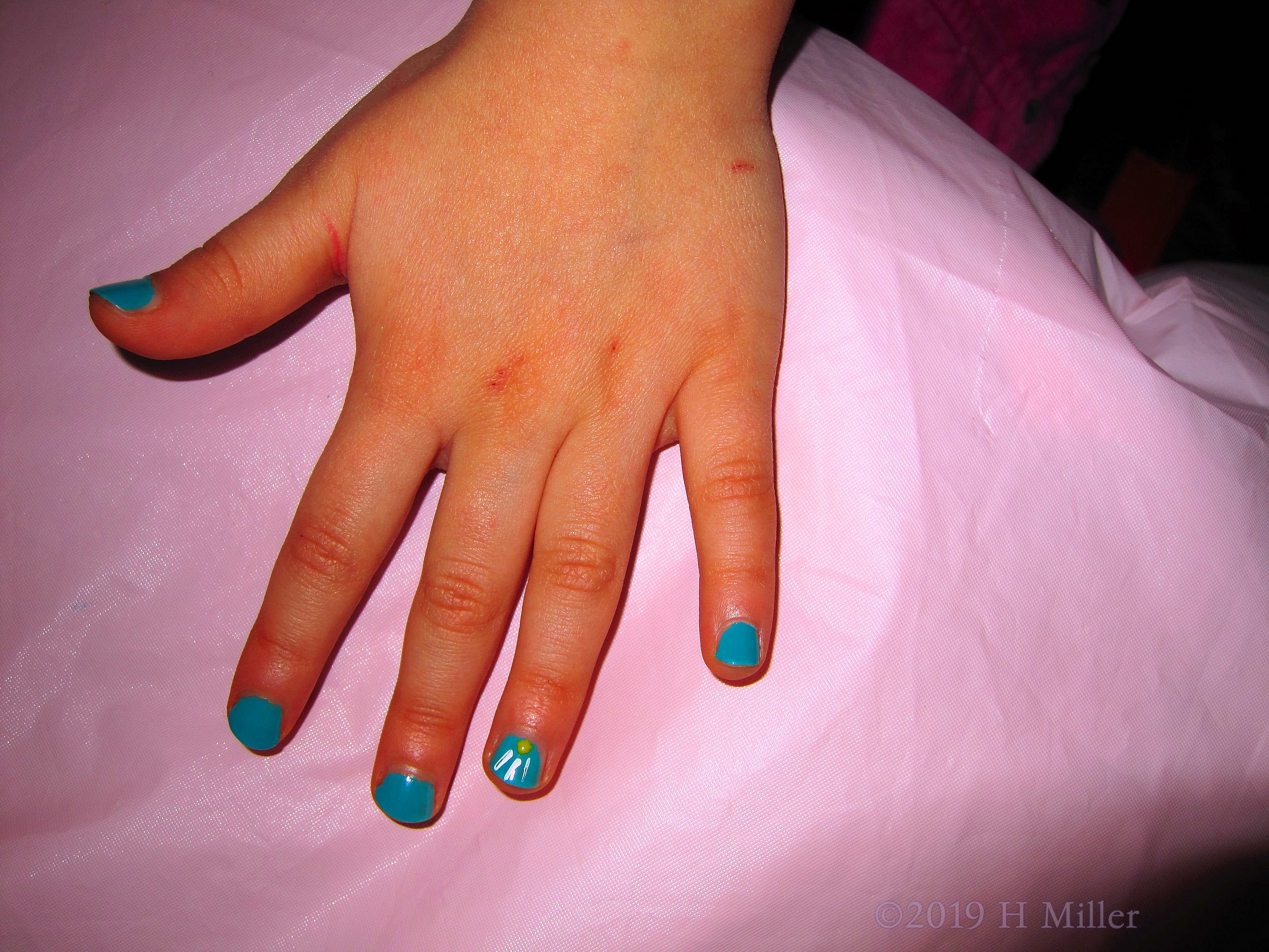 A Cool Mani For Girls Design With A Multicolor Sunflower Nail Art In Blue, White, And Green