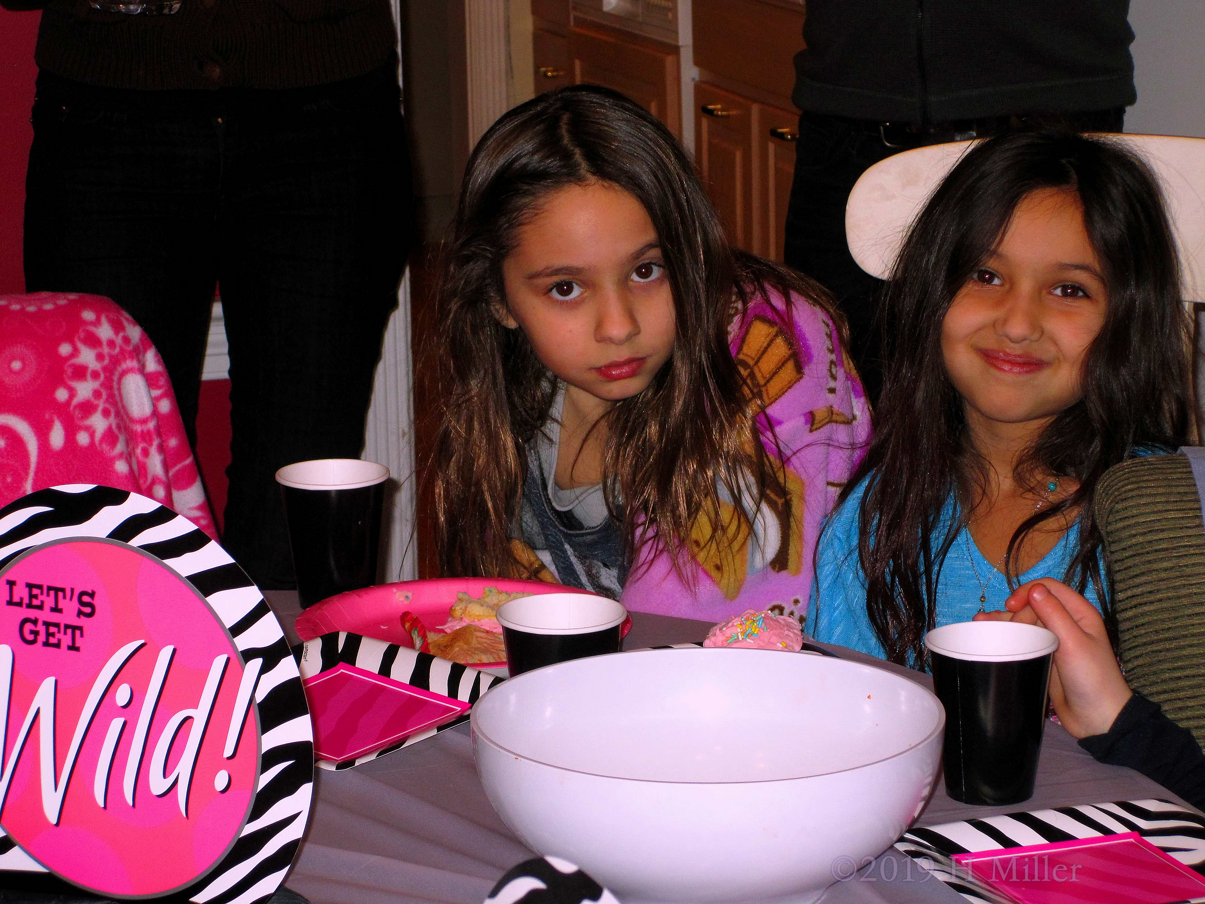 Olivia Poses With Guest During Snacks At The Girls Spa Party 