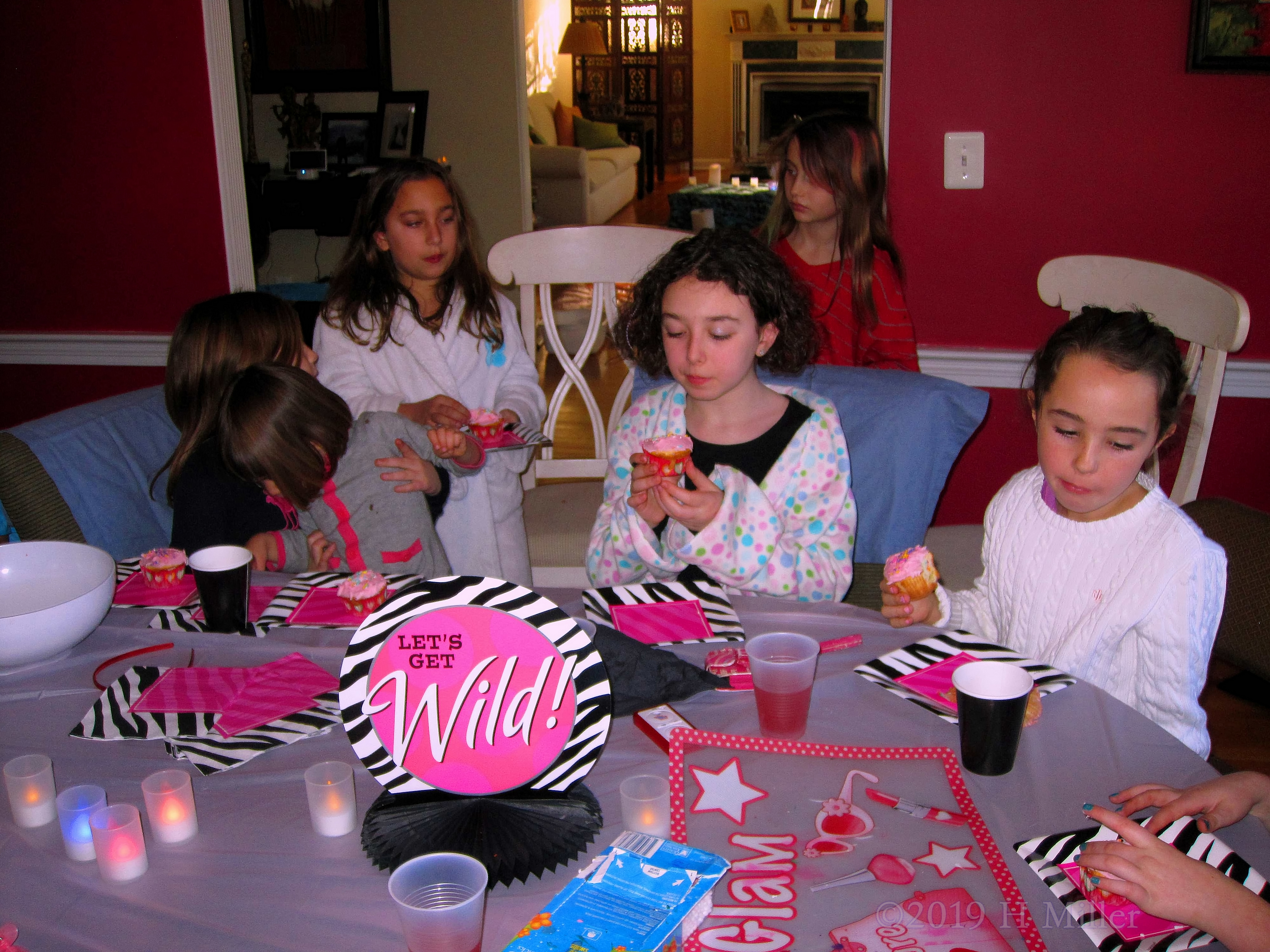 Party Guests Enjoy Yummy Cupcakes 