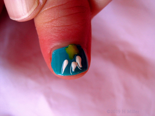 Closer View Of Nail Art Multicolor With White And Green Detail On Blue Backgroun