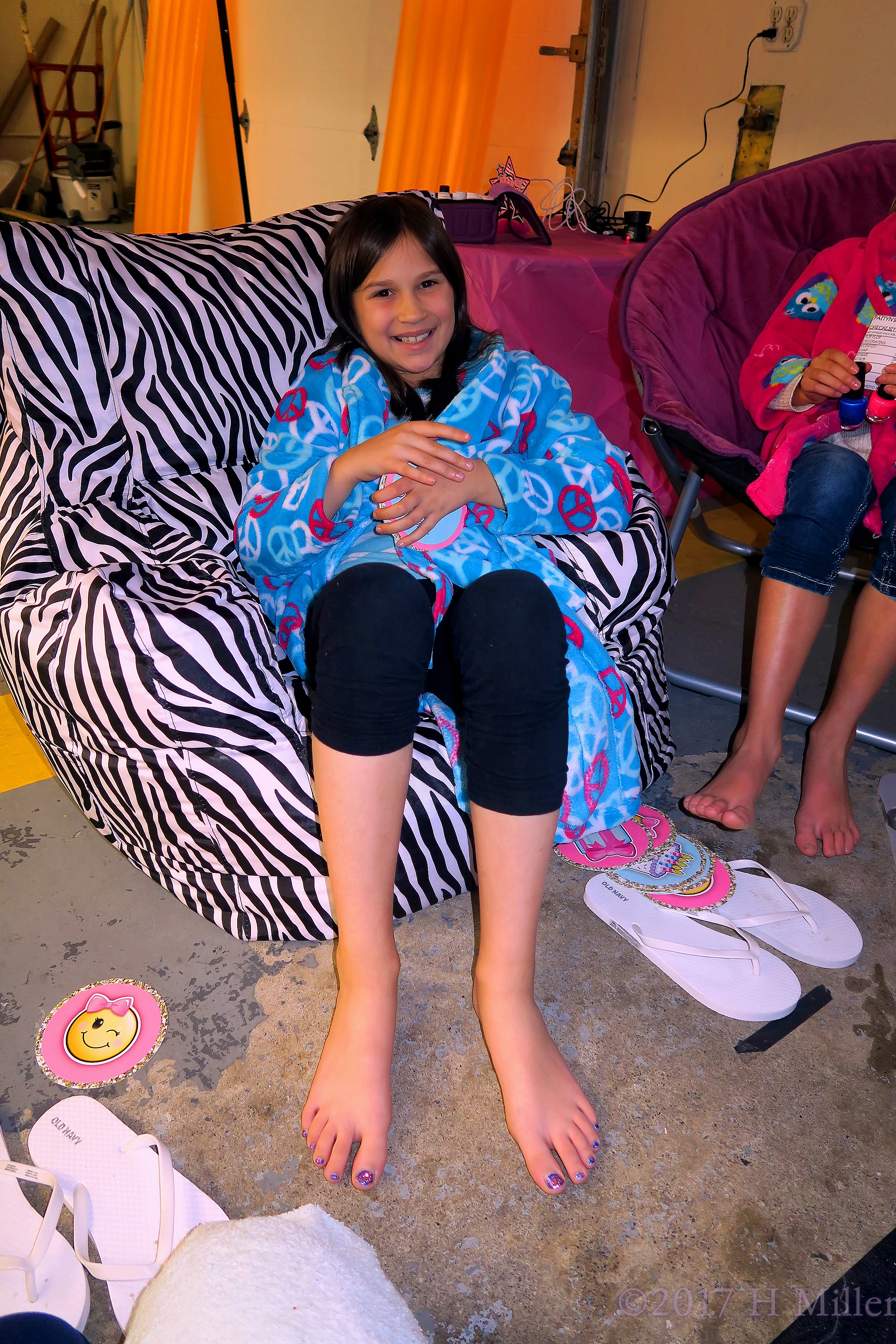 Showing Off Her Blingy Kids Pedicure Nails. Showing Off Her Blingy Kids Pedicure Nails.