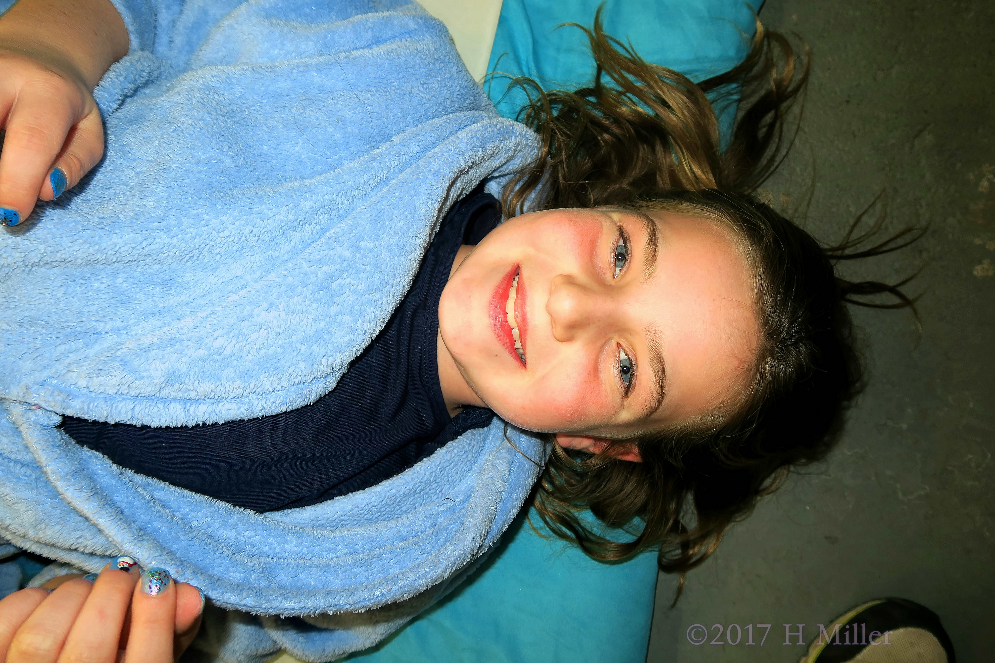 Dark Blue And Light Blue Contrasting Kids Mani And Spa Robe In This Before Kids Facial Photo. Dark Blue And Light Blue Contrasting Kids Mani And Spa Robe In This Before Kids Facial Photo.