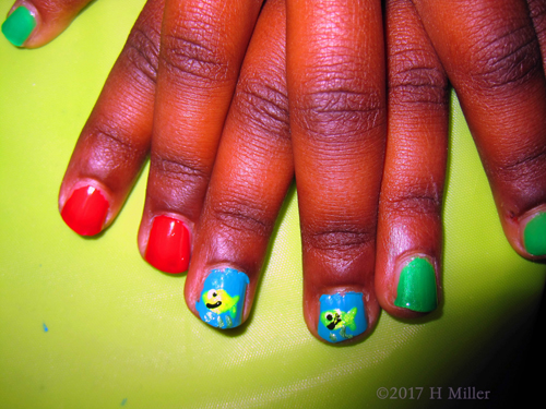 Blue Red And Green Make A Great Background For The Fish Kids Nail Design.