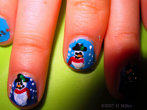 What Better Way To Say Winter Than With A Snowman Nail Design!
