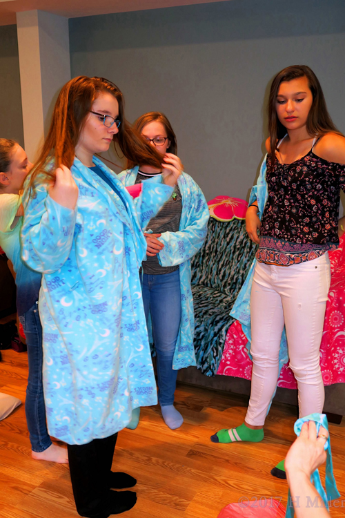 The Girls Putting On Their Spa Robes The Girls Putting On Their Spa Robes