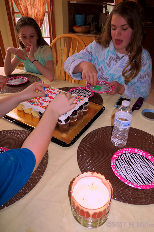 Removing The Candles From Her Birthday Cake!