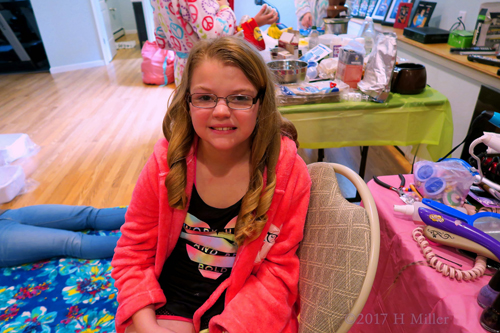 While She Poses With Her New Girls Hairstyle, The Rest Of The Party Guests Are Busy With Other Spa Party Activities!