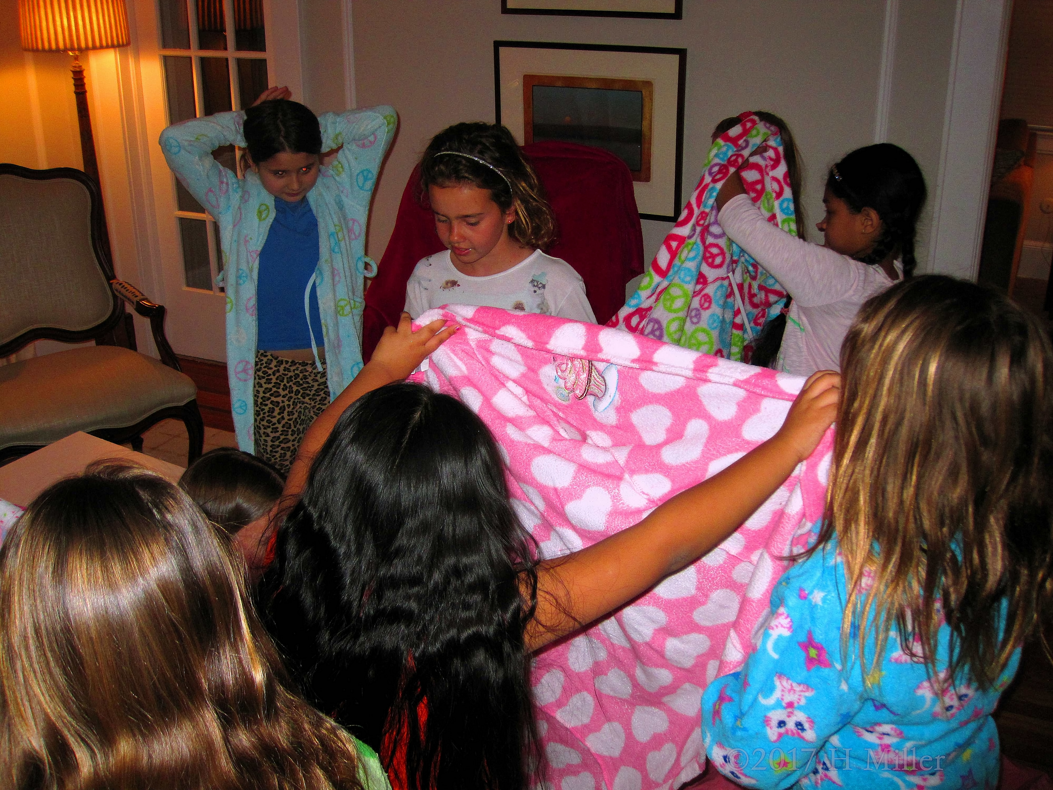 Girls In Various Stages Of Picking And Wearing Their Spa Robes Girls In Various Stages Of Picking And Wearing Their Spa Robes